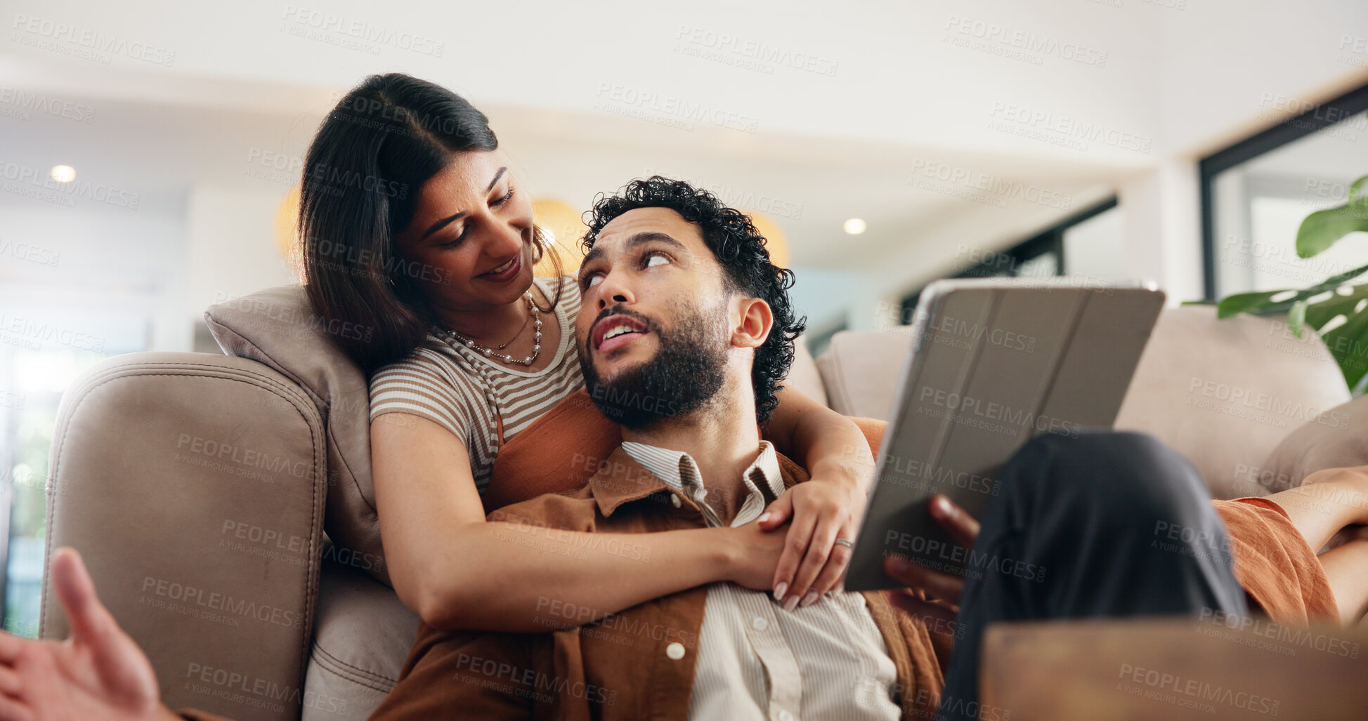Buy stock photo Couple, relax and talking with tablet on sofa for online shopping, social media scroll and bonding together. People, smile and digital app in home for web research, streaming service and low angle