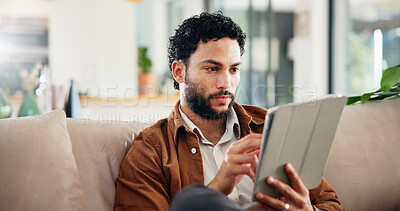 Buy stock photo Man, relax and reading on sofa with tablet, social media and ebook for information in home. Person, network or tech in living room for streaming subscription, email notification and download new app