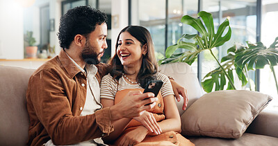 Buy stock photo Home, funny or couple on sofa, smartphone or smile with social media, comedy video or relationship. Digital app, man or woman on couch, cellphone or laughing with internet, conversation or marriage