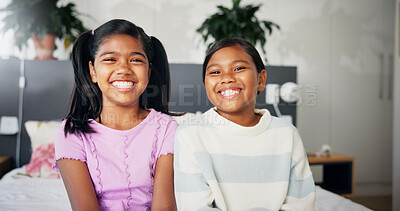 Buy stock photo Girl, sisters and smile in portrait on bed for bonding, connection and support in bedroom. Happy family, siblings and confidence in home for weekend break, relax and relationship with love and care