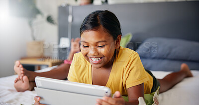 Buy stock photo Home, bedroom and girl with tablet, smile and relax with weekend break, screen time and entertainment. Apartment, kid and childhood with tech, online games and digital app to read ebook and internet