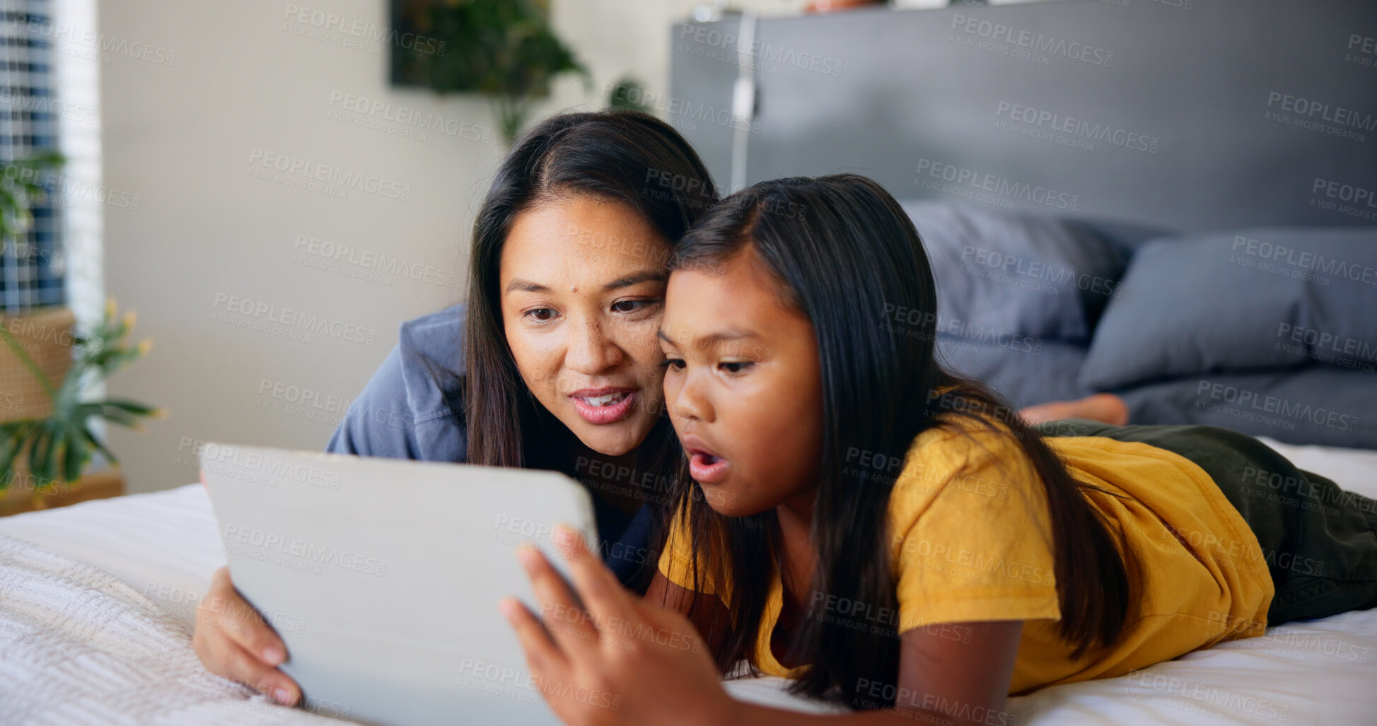 Buy stock photo Surprise, tablet and mother with daughter in bedroom for streaming service, movie subscription and wow. Bonding, cartoon and entertainment with woman and child at home for app, digital and reaction