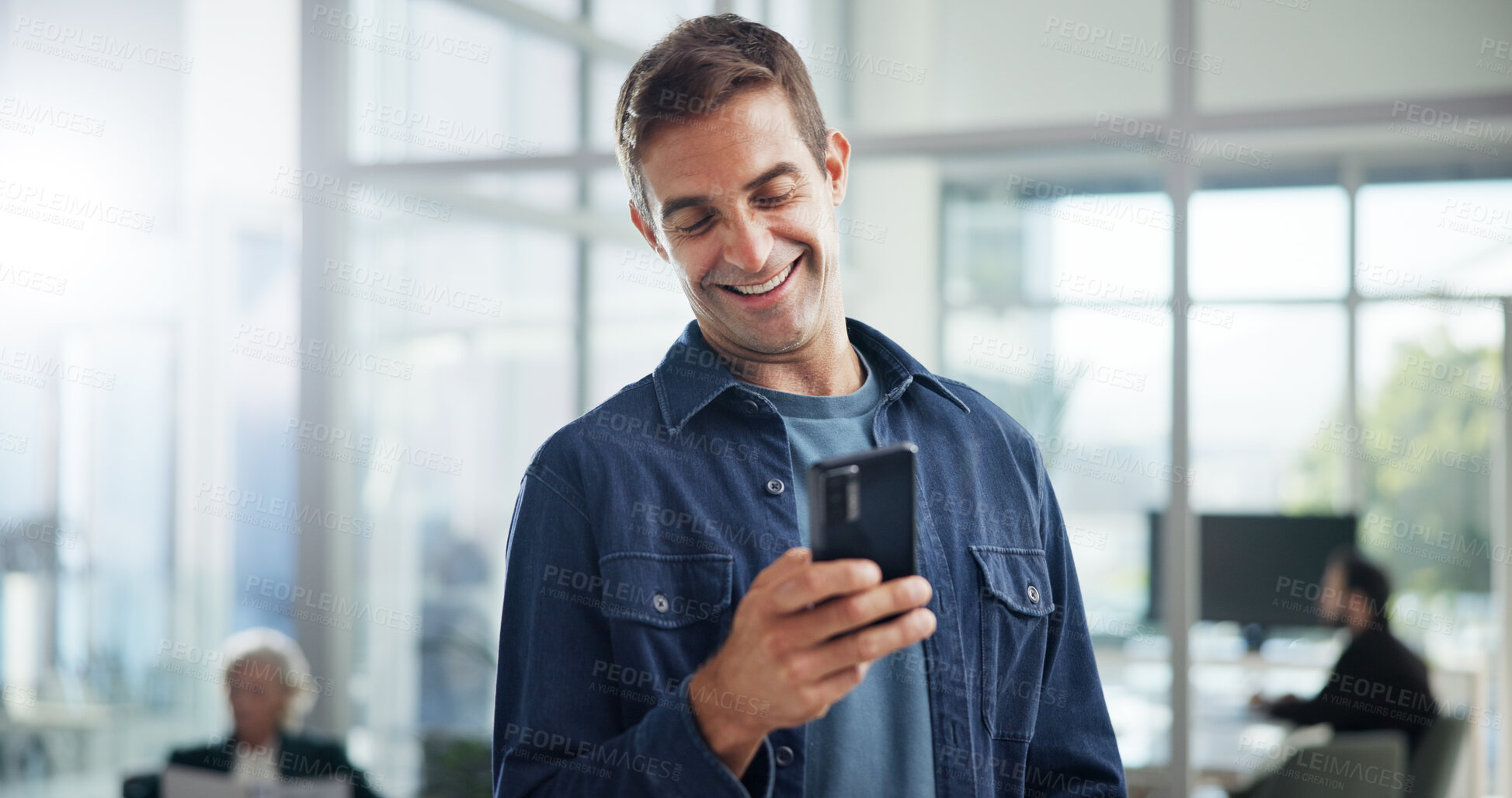 Buy stock photo Smile, office and business man with mobile for networking, typing and social media marketer online. Smartphone, startup and creative worker reading email, campaign and brand promotion on platform