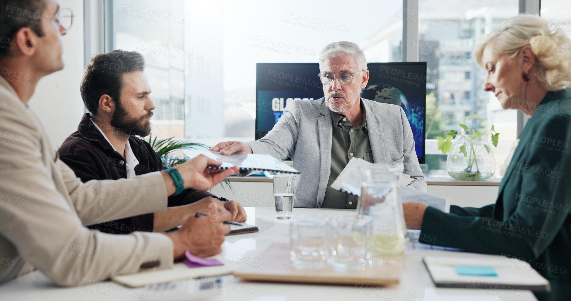 Buy stock photo Serious, group and documents in meeting, collaboration and negotiation for global trade in business. Teamwork, colleagues and people with paperwork for international investment, trader and ideas