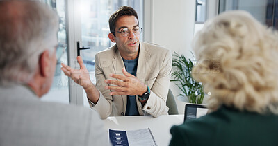 Buy stock photo Office, meeting and businessman with discussion for finance, investment briefing or review proposal. Collaboration, employees and financial advisor with corporate paper for feedback, report or advice