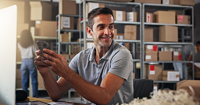 Buy stock photo Logistics, phone and planning with man in distribution depot for courier communication or update. Boxes, smile and supply chain with happy employee in office for delivery, ecommerce or shipping