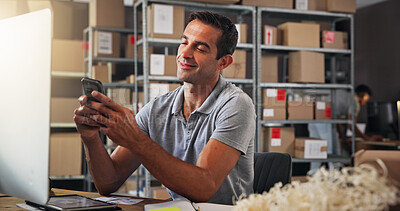 Buy stock photo Phone, smile and shipping with man in distribution warehouse for online order or service update. Boxes, computer and logistics with happy employee in office for delivery, ecommerce or supply chain