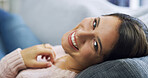 Happy woman, portrait and relax with sofa for weekend, holiday or lying with comfort at home. Face, female person or joy with smile for comfy break, rest or day off on living room couch at house