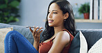 Woman, speakerphone call and talk on sofa, conversation and gossip with mobile networking in living room. Person, girl and relax with smartphone for contact, story and chat on couch at apartment