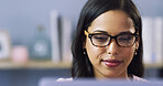 Glasses, laptop and student with woman in home for college research or online study report. Computer, education and university with person in apartment, dorm or flat for distance or remote learning