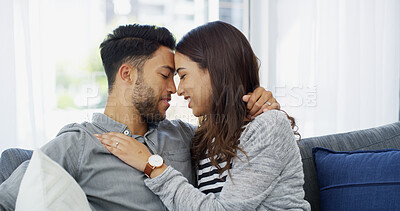 Buy stock photo Relax, love and forehead with couple on sofa of home for bonding, support and hug. Happiness, commitment and trust with man and woman in living room of apartment for peace, smile and romance