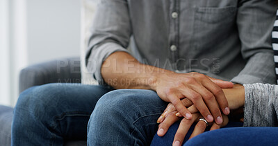 Buy stock photo Couple, holding hands and touch with empathy on sofa for love, care or commitment at home. Closeup, man and woman with sympathy for bonding, comfort or marriage support together on couch at house