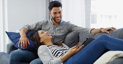 Buy stock photo Home, credit card and couple with tablet, funny and relax with ecommerce, transactions and laughing. Apartment, happy man and woman on couch, online banking and tech with savings, mortgage and humor