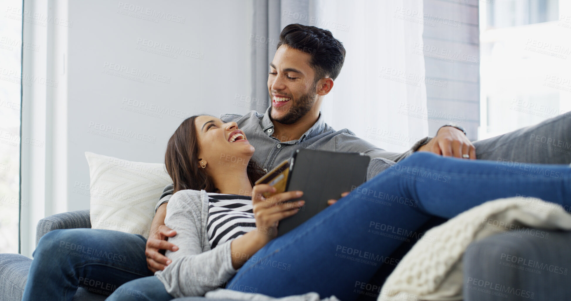 Buy stock photo Happy couple, laughing and relax with tablet on sofa for social media, entertainment or bonding at home. Man, woman or lovers with smile on technology for fun streaming, online browsing or funny app