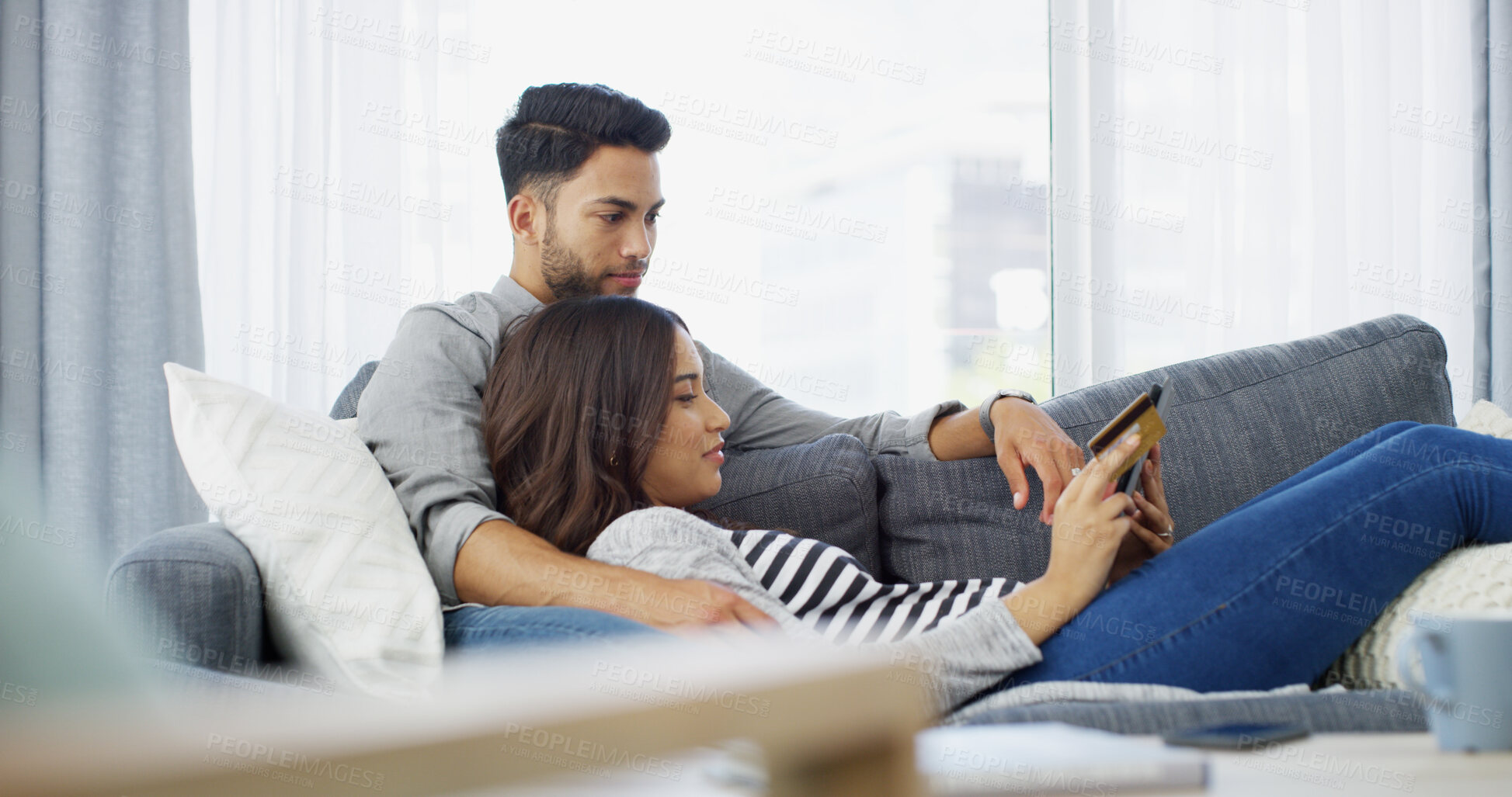 Buy stock photo Home, credit card and couple with tablet, online shopping and relax with ecommerce, rent and payment. Apartment, man and woman on couch, banking and technology with financial transactions or mortgage