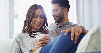 Buy stock photo Happy, relax and couple with coffee in home for conversation, bonding and rest together. Sofa, dating and man hug woman with drink for relationship, affection and embrace for love in living room