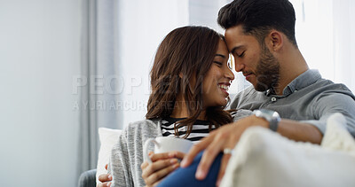 Buy stock photo Embrace, smile and couple with coffee, home and chilling in living room with woman, bonding or love. Happy, man and romance with partner in lounge, tea and comfortable in house, relax or relationship