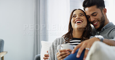 Buy stock photo Love, laughing and couple with coffee, home and chilling in living room with woman, hug and bonding. Happy, man and romance with partner in lounge, tea and comfortable in house, relax or relationship