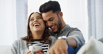 Buy stock photo Romance, laughing and couple with coffee, home and love in living room with woman, hug and bonding. Happy, man and relax with partner in lounge, tea and comfortable in house, chilling or relationship