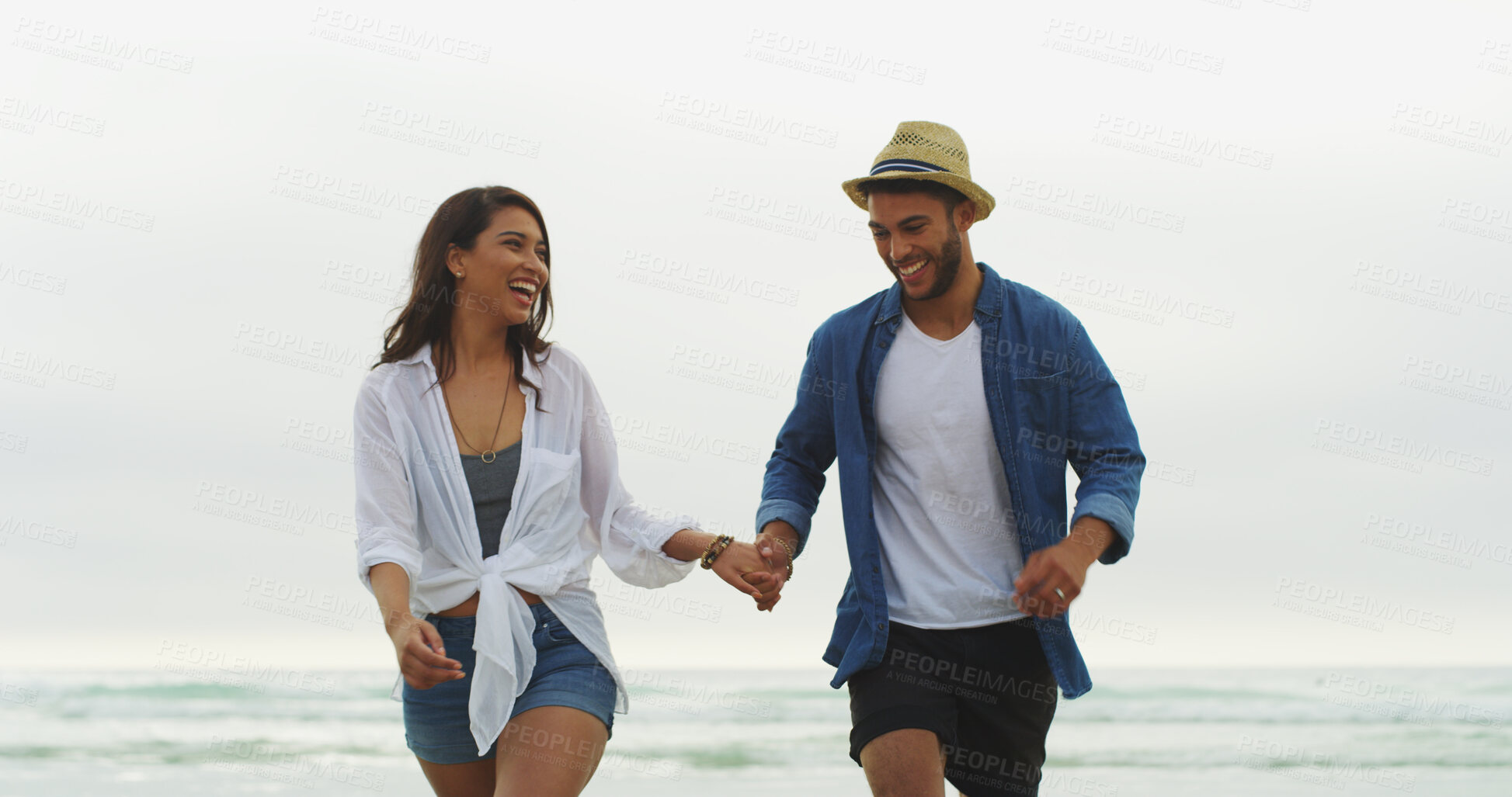 Buy stock photo Couple, beach and happy on vacation with holding hands, holiday or bonding outdoor in nature. Woman, man and relationship by sea for fun memory, romantic date and love with trust in commitment 