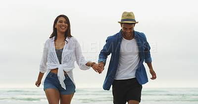 Buy stock photo Happy couple, beach and fun on vacation while holding hands, holiday or bonding outdoor in nature. Woman, man and playful run by sea for memory, romantic date and love with trust in commitment 