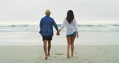 Buy stock photo Holding hands, beach and couple walking together on honeymoon, holiday or bonding outdoor. Woman, man and relationship by sea for memory, romantic date and back with love, trust and travel space