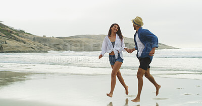 Buy stock photo Couple, beach and holding hands with love on vacation for honeymoon, holiday or bonding outdoor in nature. Happy woman, man and run by sea for fun, romantic date and playful with trust in commitment 