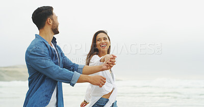 Buy stock photo Happy couple, beach and holding hands with love on vacation for honeymoon, holiday or bonding outdoor. Woman, man and relationship by sea for laugh, romantic date and space with playful partner