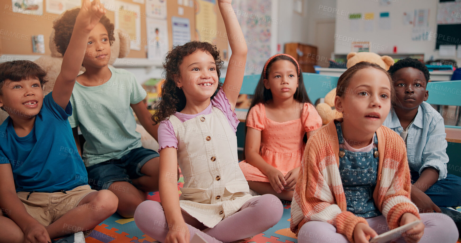 Buy stock photo Students, children and hands raised with answer in classroom for feedback, lesson question and knowledge. People, happy and problem solving on floor for learning development, education quiz and smart