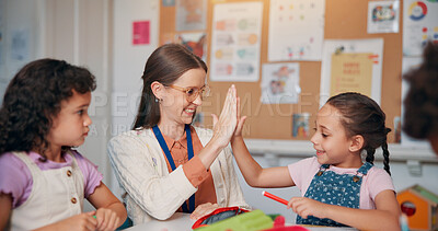 Buy stock photo Education, girl and teacher in school, high five and support with child development. Growth, woman, and kids in classroom, hand gesture or results for test, top mark or collaboration with celebration
