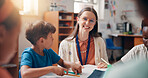Education, learning or study with students and teacher in classroom of school for child development. Growth, knowledge or teaching with smile of woman with kids in lesson for academics or course