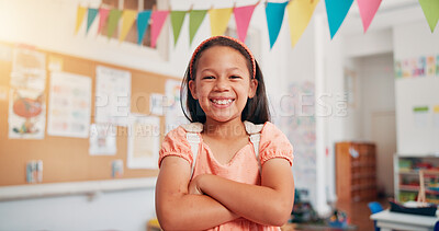 Buy stock photo Arms crossed, student and smile with girl in classroom for learning, future and youth. Scholarship, academy and growth with portrait of kid in school for child development, knowledge and education
