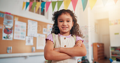 Buy stock photo Arms crossed, smile and education with girl in classroom for learning, future and youth. Scholarship, academy and growth with portrait of student in school for child development, knowledge and lesson