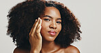 Cotton, studio or African woman with beauty, portrait or hygiene for treatment or cleaning face. Girl, white background or model with confidence, cosmetics or facial skincare with makeup removal pad