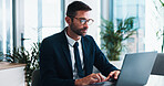 Businessman, typing and browsing with laptop for financial report, review or corporate statistics. Male person, accountant or office with computer for company finance, budget or planning at workplace