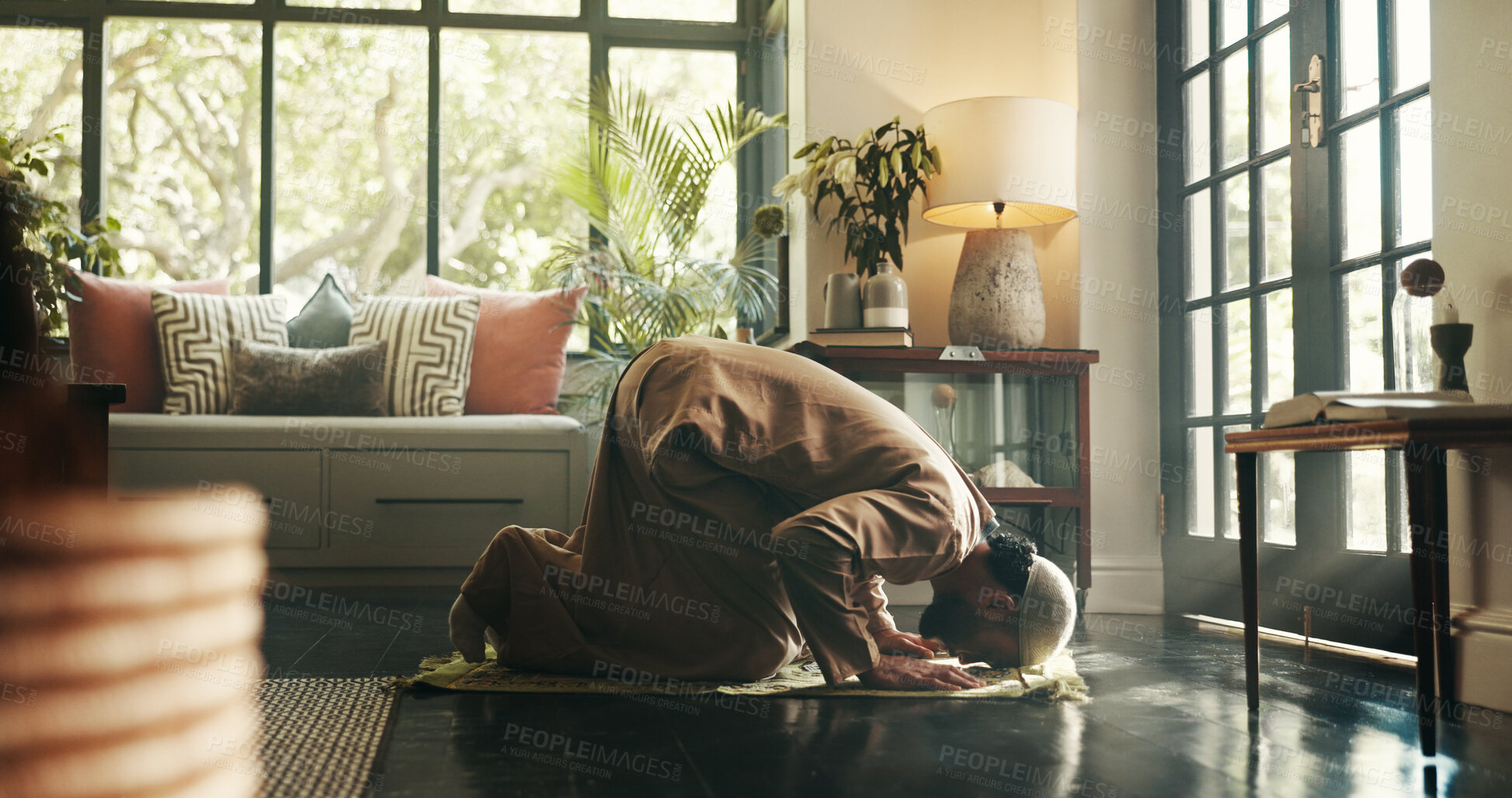 Buy stock photo Muslim, prayer and floor with man in home for ramadan kareem, spiritual and worship. Religion, faith and eid Mubarak with Islamic person and salah in living room for holy month, Allah praise and dua
