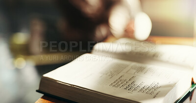 Buy stock photo Quran, closeup and faith in home, book and study for religion, Islam and desk with education. Empty room, Koran and word of God, Allah and prophet Muhammad for blessings, Ramadan or Eid at apartment