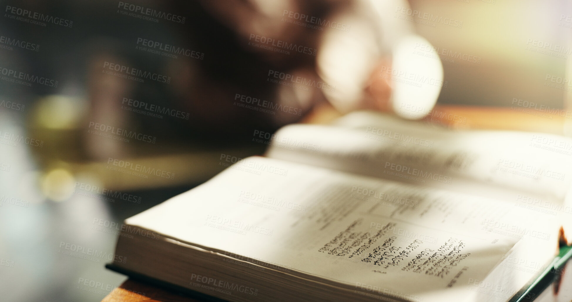Buy stock photo Quran, closeup and faith in home, book and study for religion, Islam and desk with education. Empty room, Koran and word of God, Allah and prophet Muhammad for blessings, Ramadan or Eid at apartment