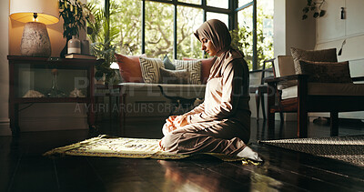 Buy stock photo Muslim woman, prayer mat and religion in home, Islam and start morning with faith for Allah in living room. Person, hijab and Ramadan on floor to praise God with fasting, dua and profile at apartment