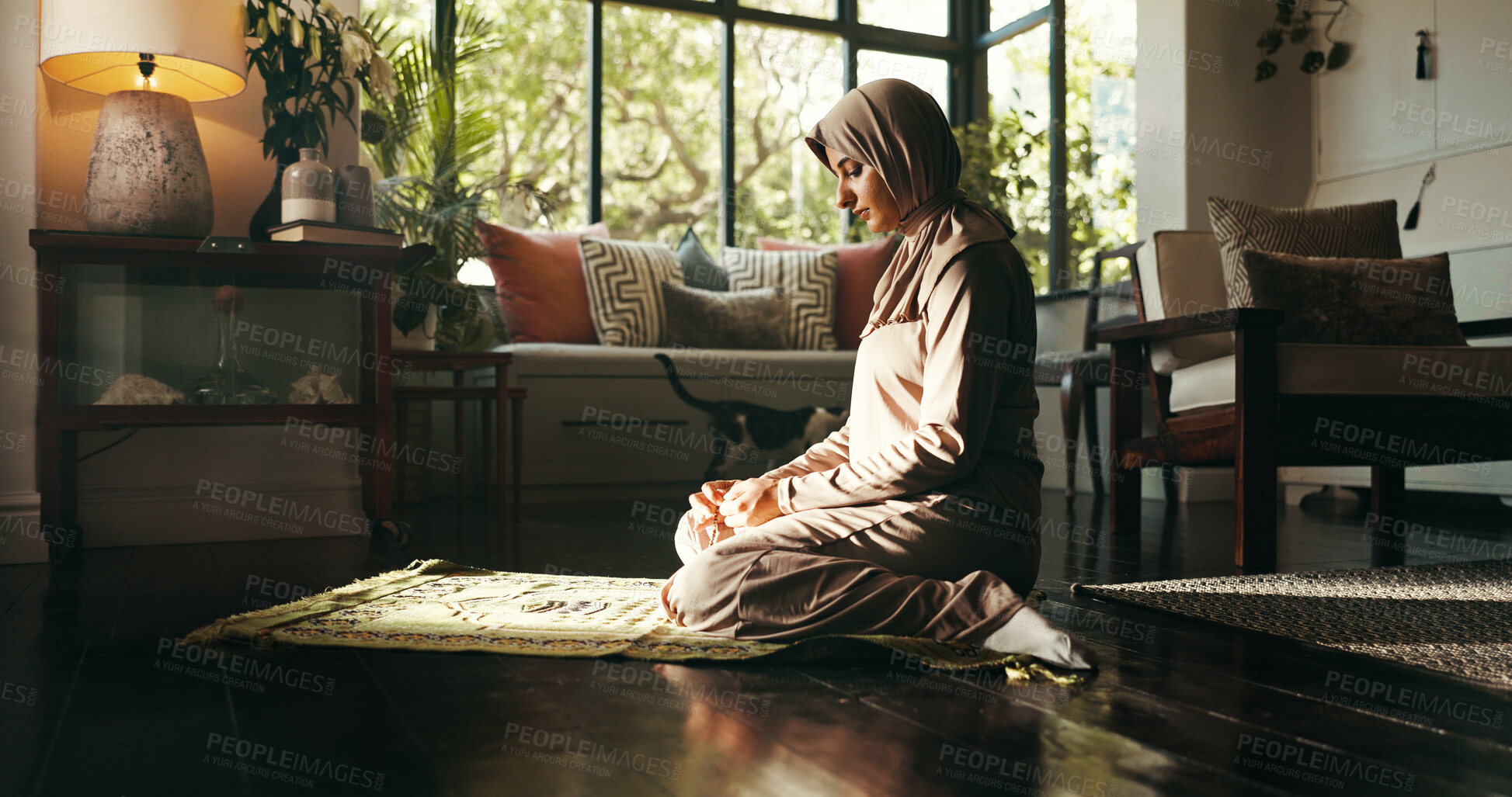 Buy stock photo Muslim woman, prayer mat and religion in home, Islam and start morning with faith for Allah in living room. Person, hijab and Ramadan on floor to praise God with fasting, dua and profile at apartment