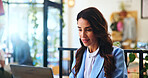 Smile, reading and laptop with woman in cafe for remote worker, typing and planning. Feedback, business and client report with person and online in coffee shop for freelancer, networking and research