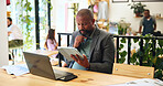Thinking, business and tablet with man in cafe for reflection, remote worker and research. Planning, client feedback and vision with male person and laptop in coffee shop for future, idea and update