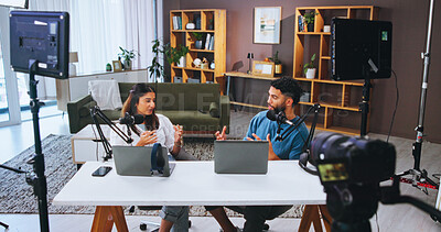 Buy stock photo Camera, microphone and podcast with people in home living room for live broadcast or recording. Conversation, laptop or streaming with man and woman influencer in apartment for content creation