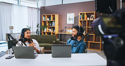 Buy stock photo Headphones, laptop and people with mic on talk show in home studio for podcast, news broadcast or live stream. Recording, host and talking to guest for public relations, web interview or social media