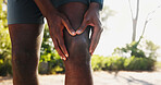 Person, hands and knee pain with injury for fitness accident, workout sprain or muscle tension in nature. Closeup, runner or joint inflammation with emergency for broken bone, sore ache or exercise