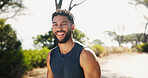 Happy man, portrait and nature with fitness on mountain for workout, exercise or health and wellness. Face, male person or active runner with smile for cardio or outdoor training for sport or run 