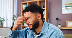 Stress, pain and man with headache in home, fatigue or exhausted with eye strain. Migraine, sick or tired person in living room with financial challenge, crisis or frustrated with debt for bankruptcy