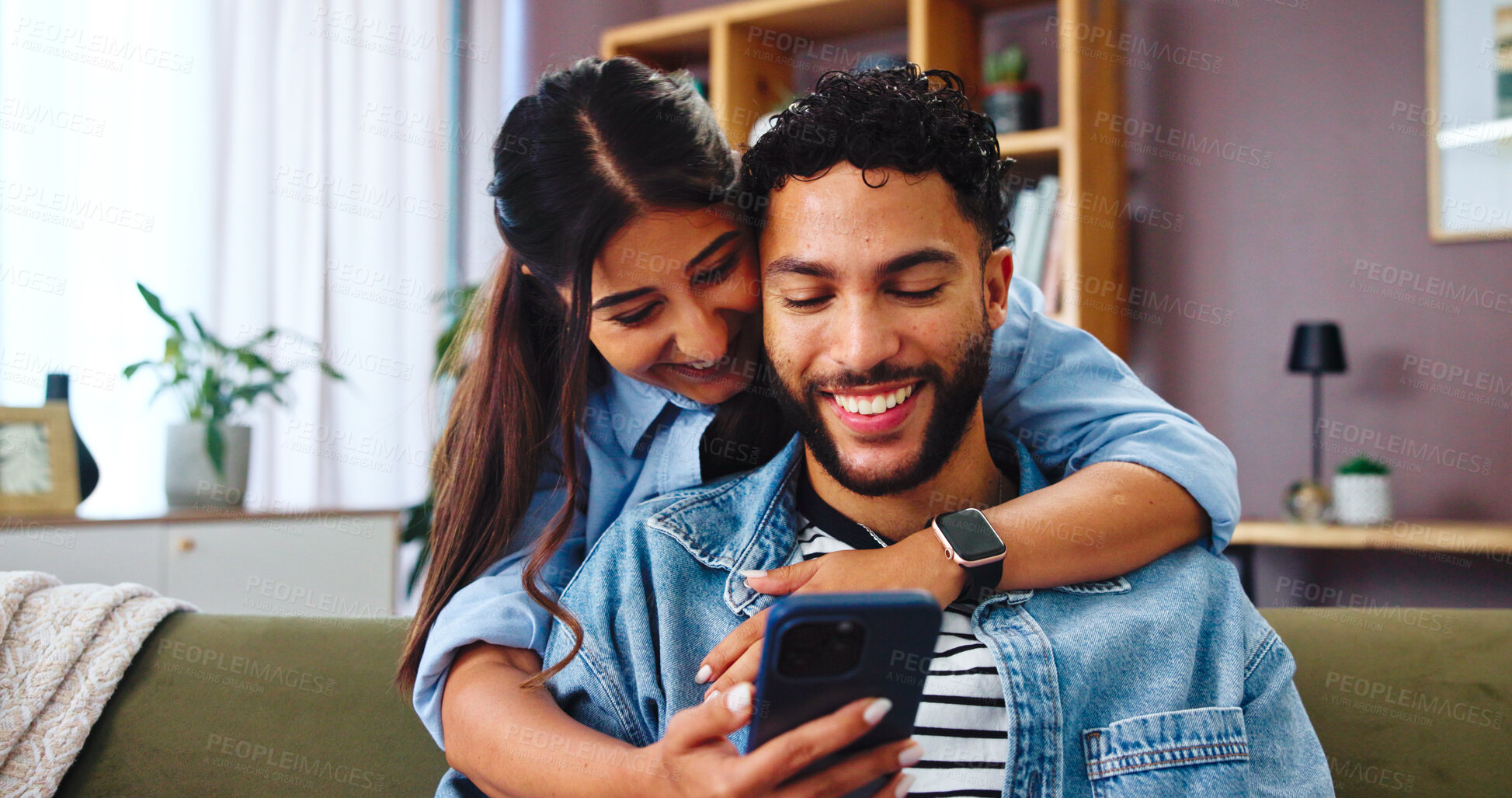 Buy stock photo Couple, smartphone and happy on sofa with hug, social media and funny gossip story in home. Woman, man and phone in living room for storytelling, comedy and celebrity news in timeline on internet