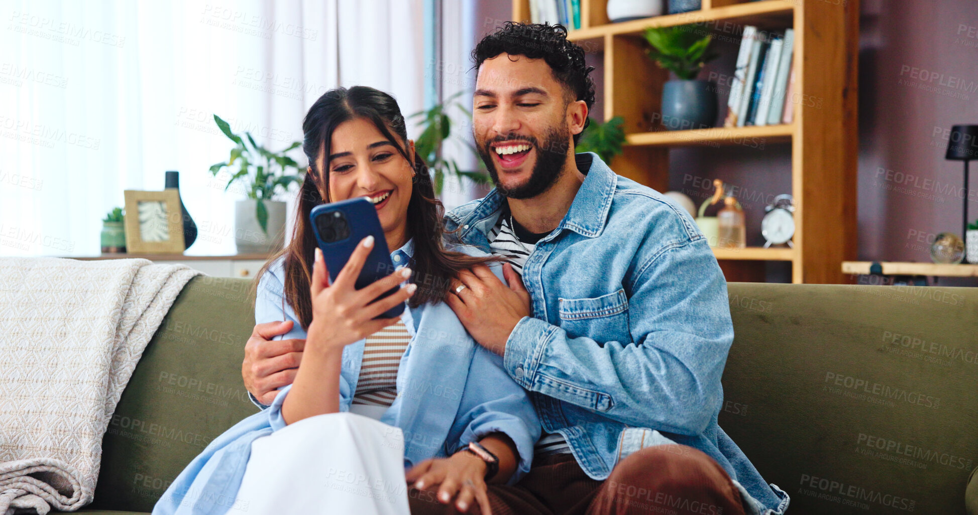 Buy stock photo Couple, smartphone and laugh on sofa with hug, social media and funny gossip story in home. Woman, man and phone in living room for storytelling, comedy and celebrity news in timeline on internet