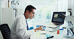 Scientist, man and typing by computer in lab for medical research with feedback, review or vaccine development. Person, report and notes for chemical analysis with pharmaceutical drugs with laptop